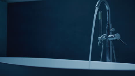 luxury modern bathtub with water flowing