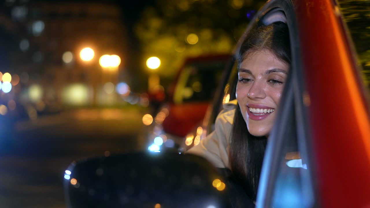 A Woman Enjoying a Nighttime Car Ride