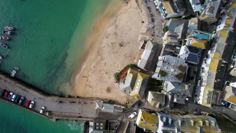 aerial drone view overlooking st ives in cornwall with a top down shot over the harbor and houses, england, uk