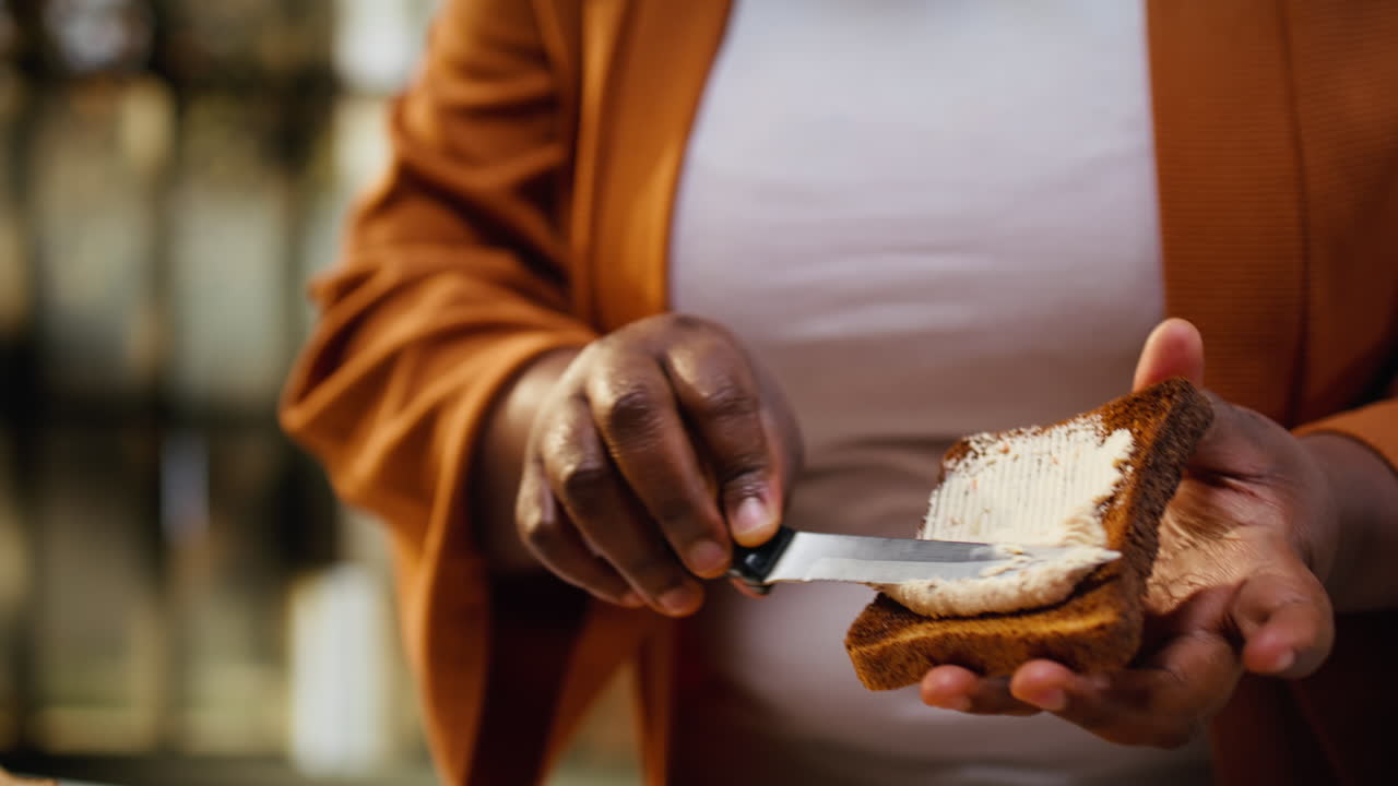 Close up, cream cheese spread, toast bread, african american vlogger