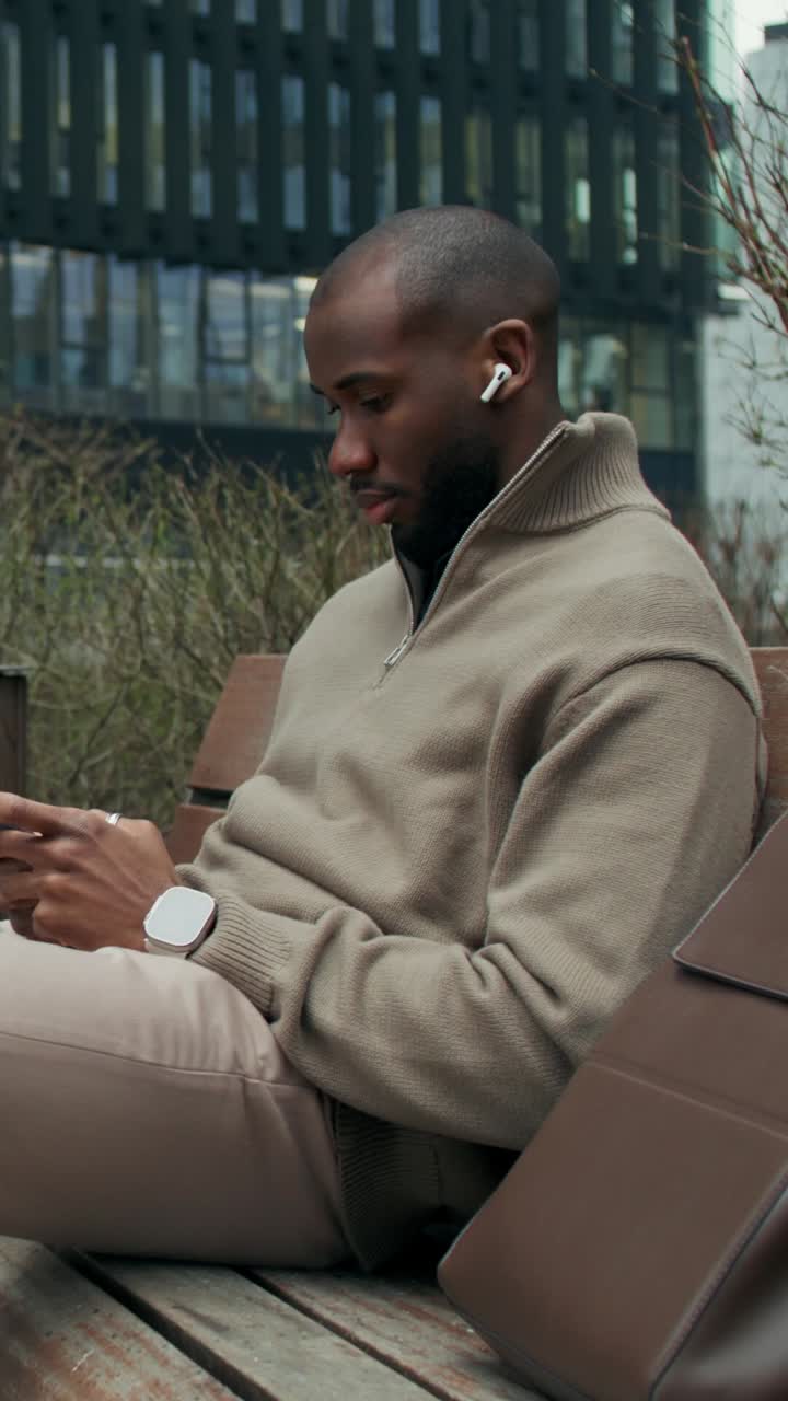 Man using smartphone outdoors