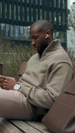 man using smartphone outdoors