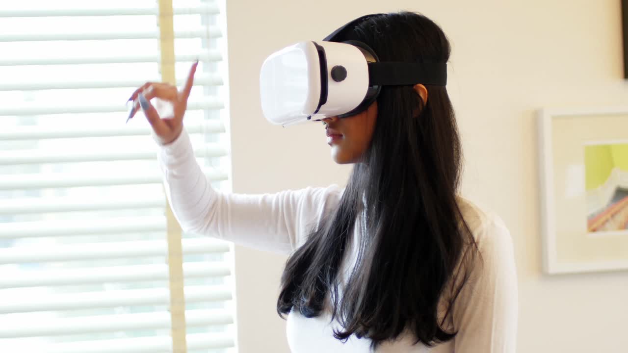 Woman using virtual reality headset in living room