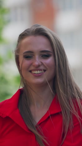 Woman walking in the street. Young beautiful woman smilling and walking in the town. Vertical video