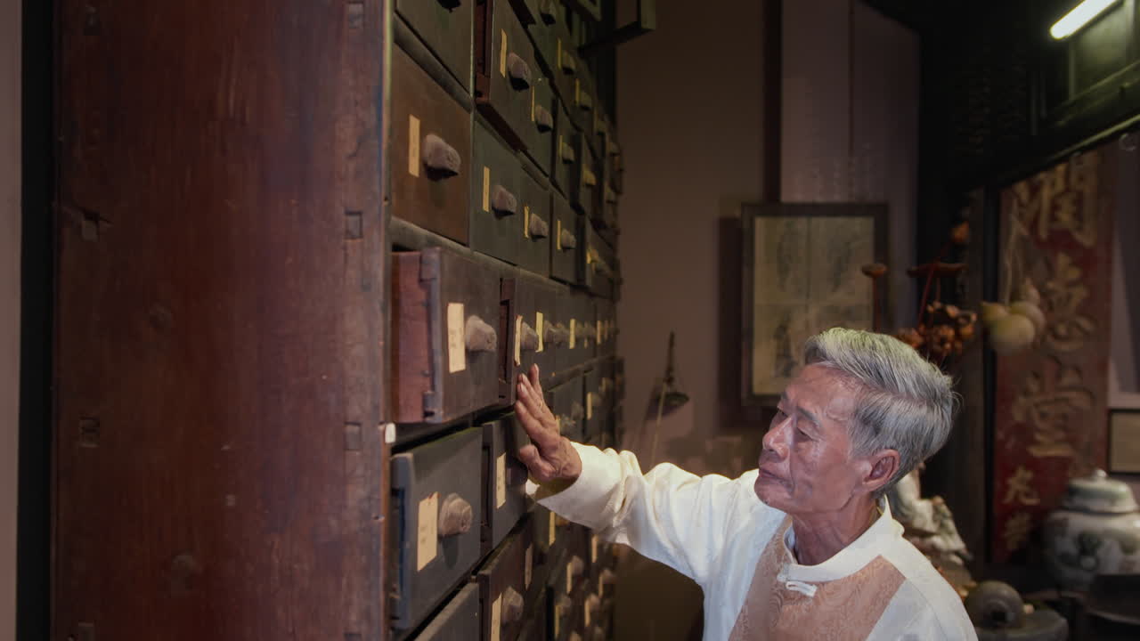 Mature Male Apothecary Looking for Herbs in Lockers