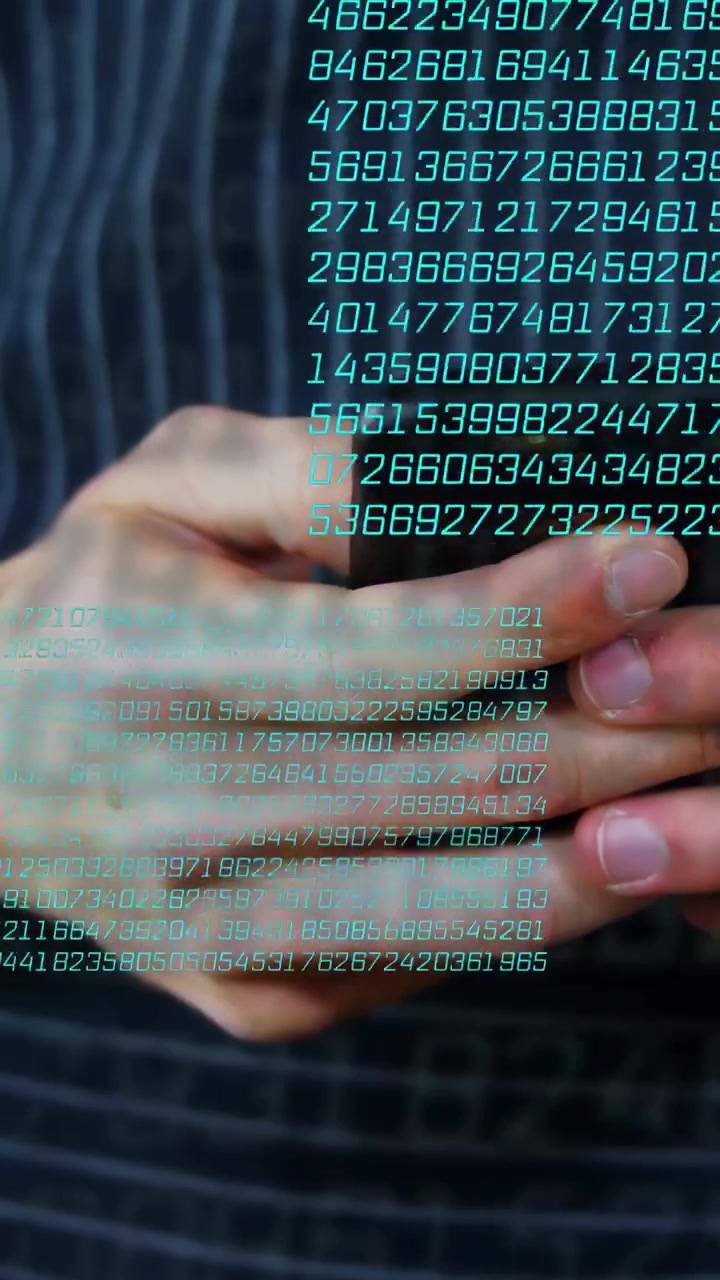 Vertical video: Man tapping phone with thumbs causing teal digits growing over hands for tech demo