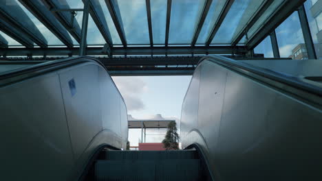 escalator exit to a new luxury office park and apartments complex on a sunny day