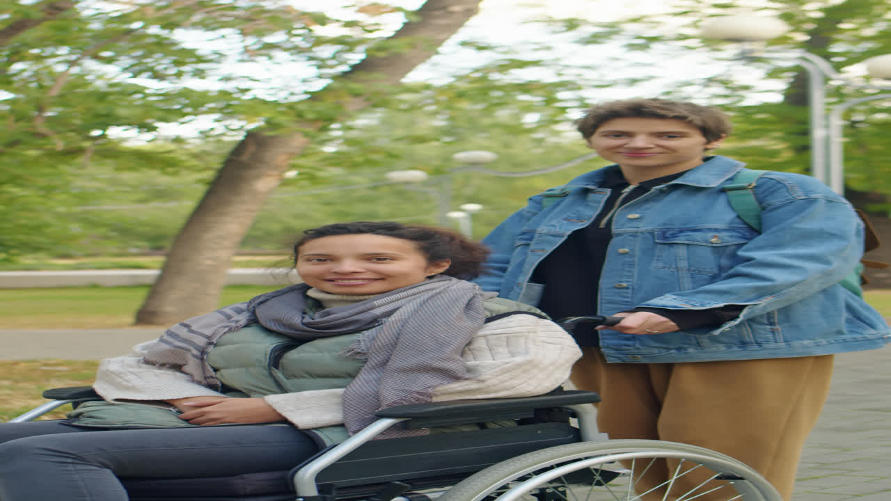 Portrait of Woman and Friend in Wheelchair in Park