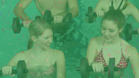animation of confetti falling over happy caucasian women and man exercising with weights in pool