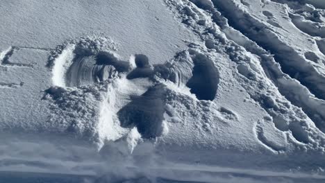 Angle-shape-curves-on-snow-field-with-letter-E-on-the-side