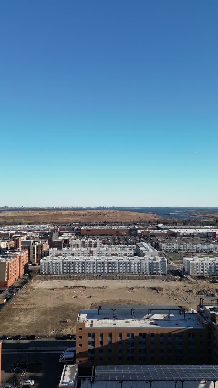 Aerial view over Brooklyn featuring Belt Parkway, Shirley Chisholm State Park, Spring Creek Beach, Pennsylvania Ave, Flatlands Ave, and Howard Beach.