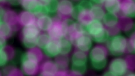 blurred pink and green circles an abstract image