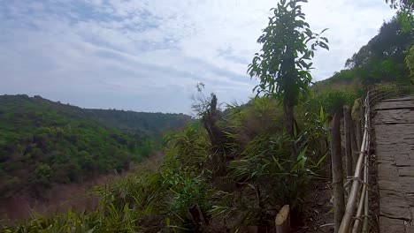 dense-green-forests-with-pristine-waterfall-and-walking-trails-at-day-from-flat-angle-video-is-taken-at-Krang-Suri-Falls-meghalaya-north-east-india