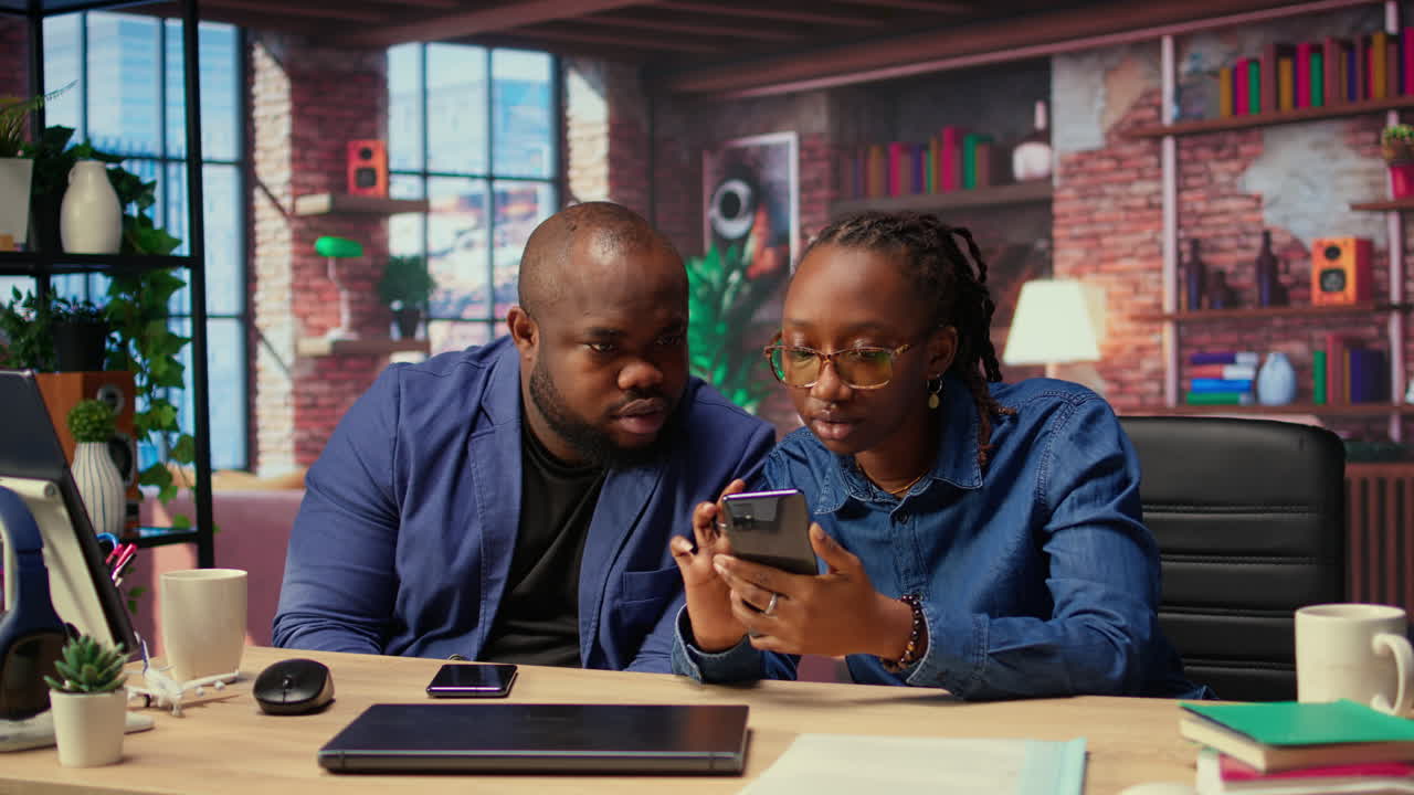 African american man and woman solving freelance tasks at home