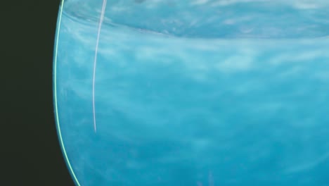 close-up of blue liquid in a glass