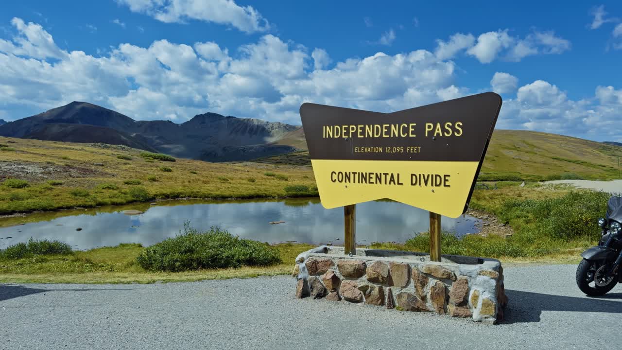 Scenic panning view of Independence Pass at the Continental Divide in the Rocky Mountains on a clear summer day