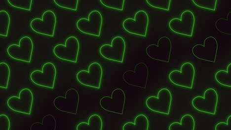 vibrant green hearts illuminate the dark glowing heart pattern on black background