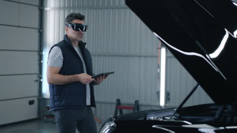 man using vr/ar headset for car inspection in a garage