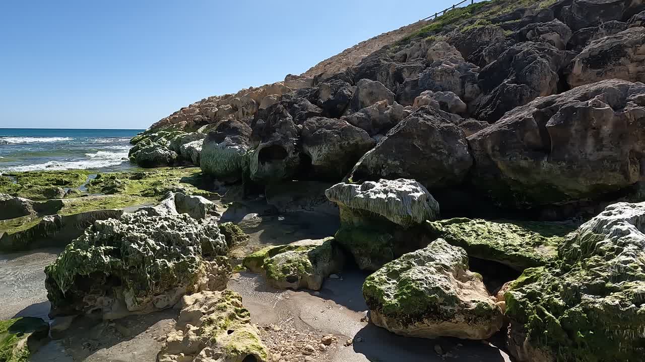 Rocky coastline and marina wall at Clayton Beach, Mindarie - Perth