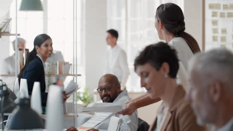 happy-business-people-celebrating-successful-corporate-victory-throwing-papers-in-air-colleagues-embrace-teamwork-in-office-meeting-enjoying-winning-success