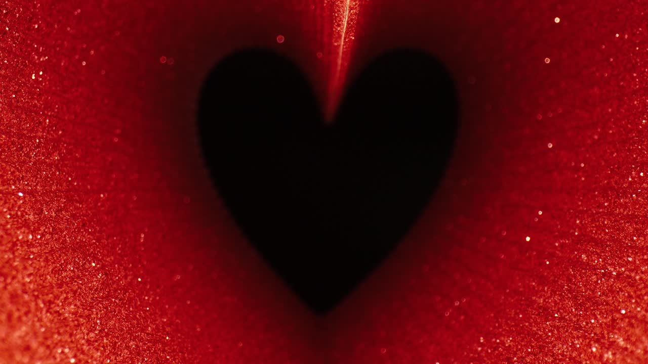 분홍색 반이는 심장 모양 프레임 검은 바탕에 움직임, 발렌타인 데이 컨셉