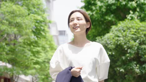 a business woman who smiles outdoors