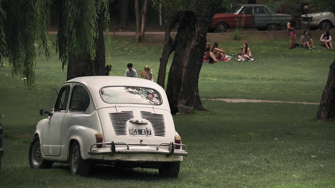 Close up shot of old Fiat parked in park, Capilla del Monte, Argentina. Gimbal