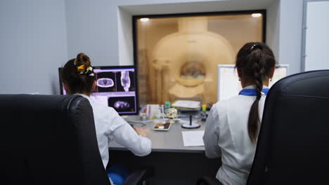 medical professionals monitoring mri scan