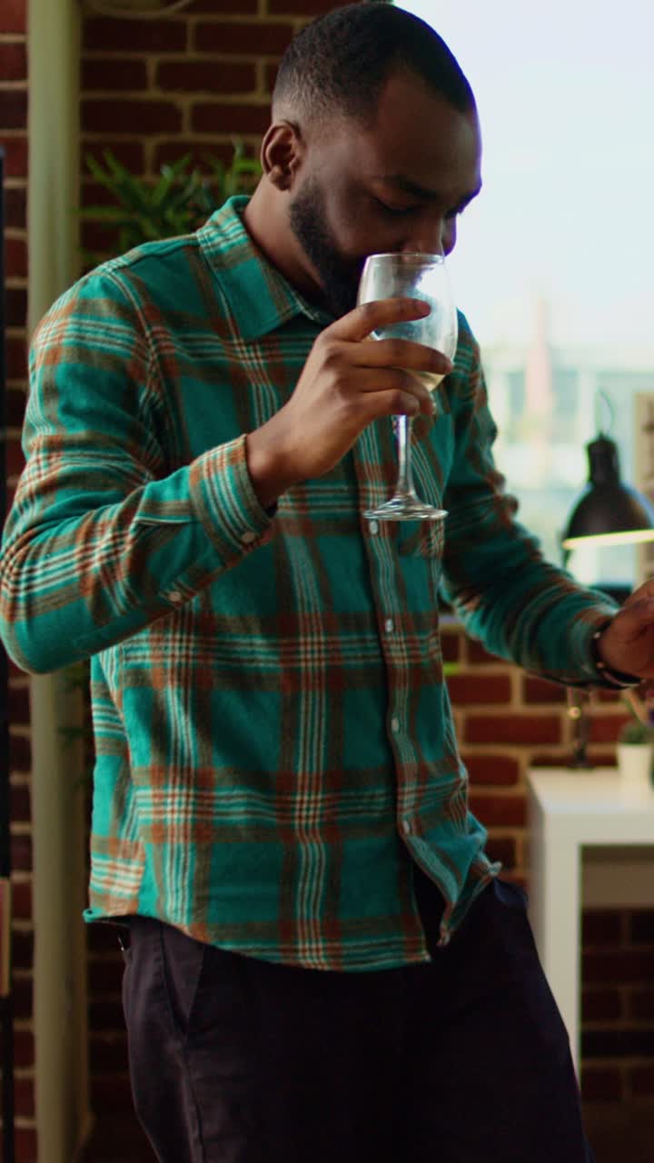 Vertical video Colleagues organizing apartment party, enthusiastically dancing to Hiphop music