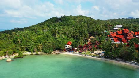 tranquil bay with calm turquoise lagoon washing sandy exotic beach and cliffs of tropical island shoreline, vacation resort in thailand