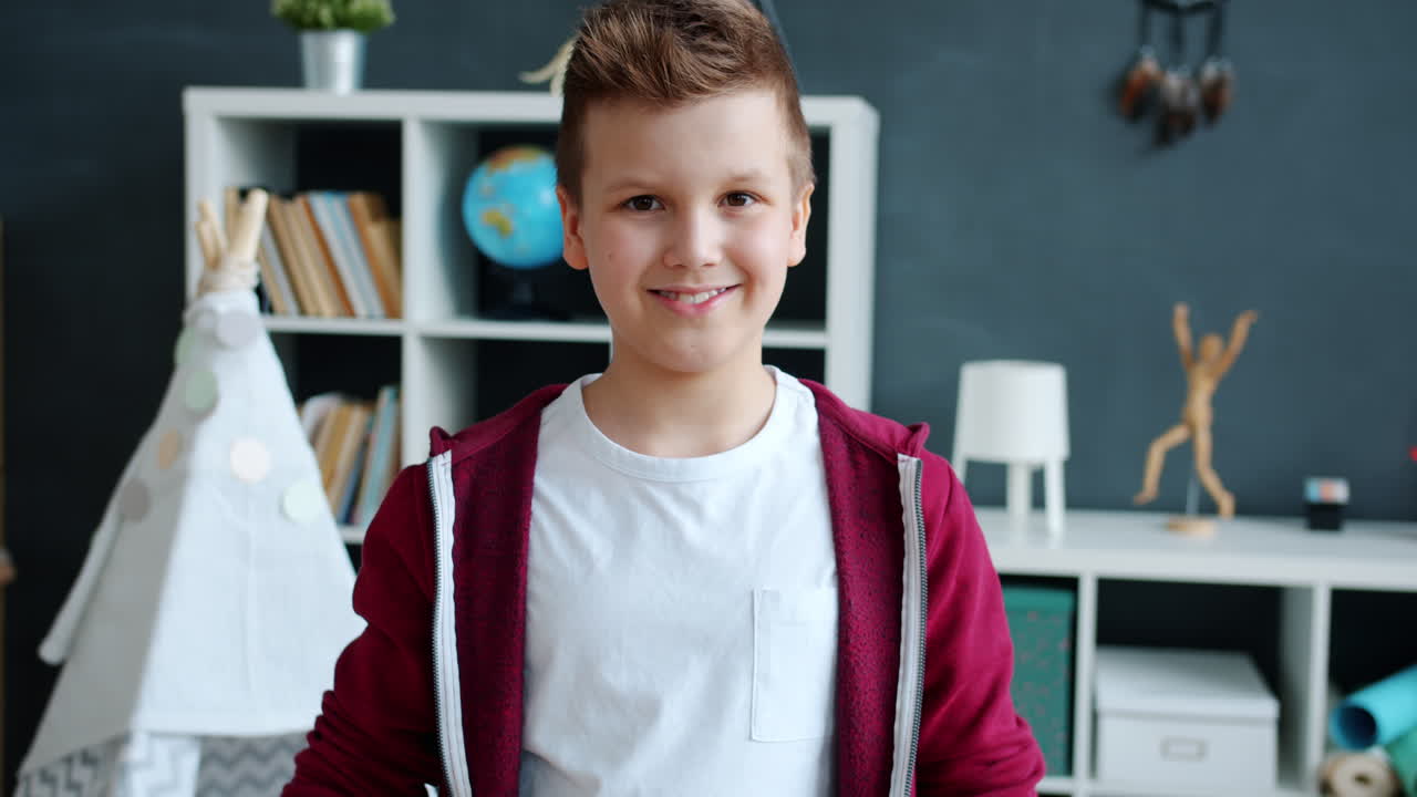 Smiling Boy with 'Okay' Hand Gesture