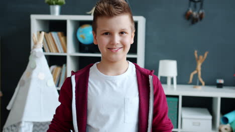 smiling boy with 'okay' hand gesture