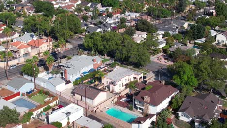 aerial view flying across burbank residential suburban houses, upscale neighborhood in daytime