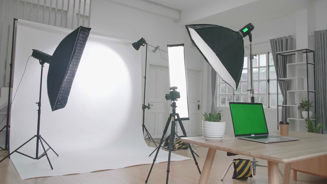 Photo Studio With Professional Equipment And Green Screen Laptop Computer Display
