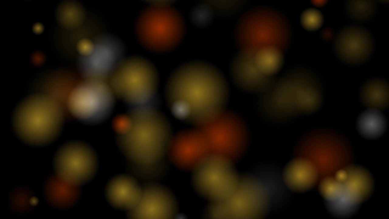 Abstract Background of Floating Golden Bokeh Lights