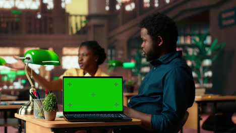 team of students working on a class assignment next to copy space screen