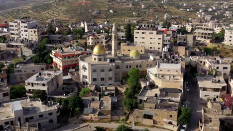 aerial view over golden dome mosque in palestine town biddu,near jerusalem