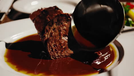 gourmet steak dinner with rich sauce