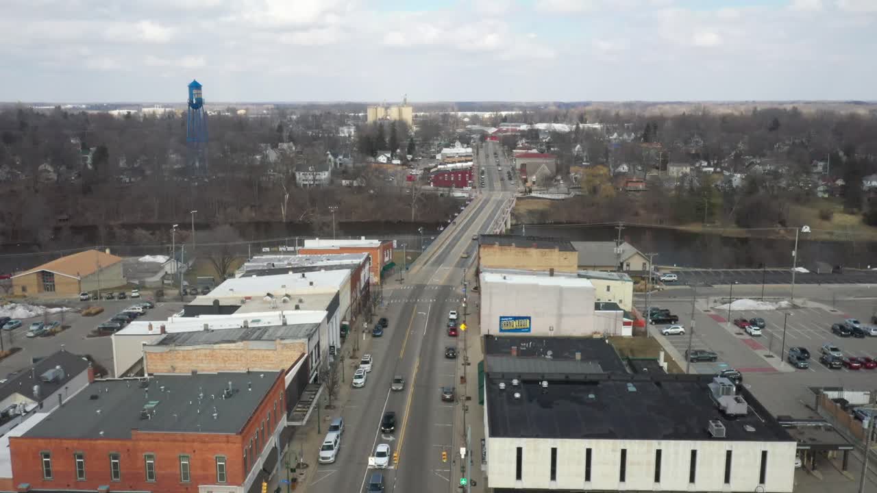 Grand Ledge, Michigan downtown skyline drone view moving forwards.