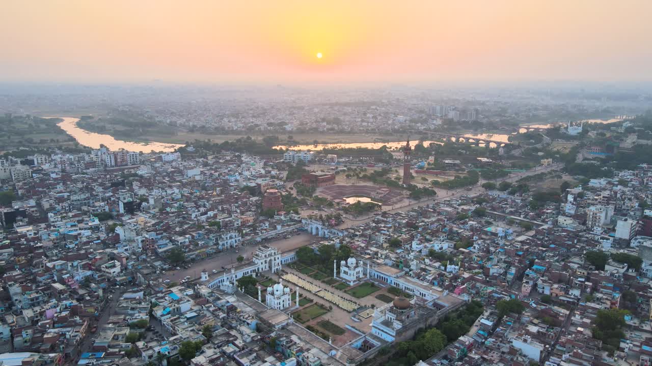 Aerial capture of Lucknow city, highlighting the Clock Tower and its surroundings in the early morning light.