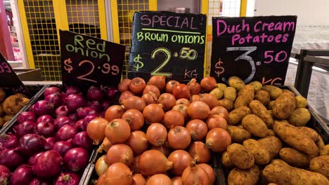 onions and potatoes on sale at market