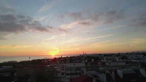 amazing aerial sunset of sun rays over the lisbon cityscape