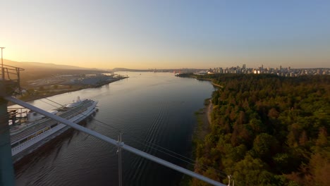 Lions-Gate-Bridge---First-Narrows-Bridge-Spanning-Burrard-Inlet-With-A-Cruise-Ship-During-Sunrise-In-Vancouver,-BC,-Canada