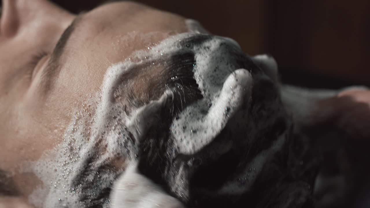 Close-up of Hair Being Washed with Shampoo and Suds