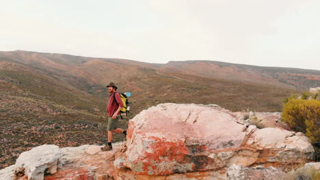 Young-Caucasian-man-explores-rugged-outdoor-terrain-with-copy-space