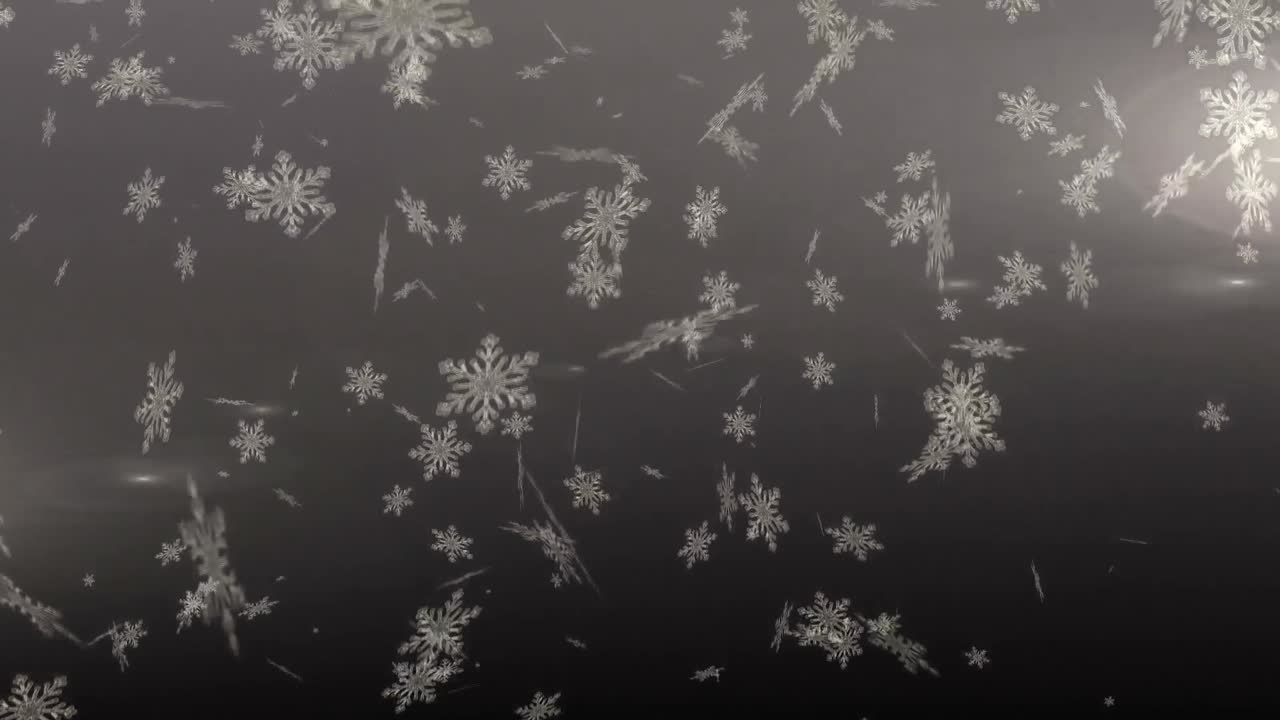 copos de nieve cayendo contra un fondo gris