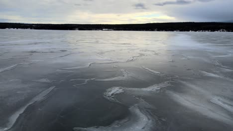 an aerial panoramic of a frozen lac la hache lake in british columbia, canada