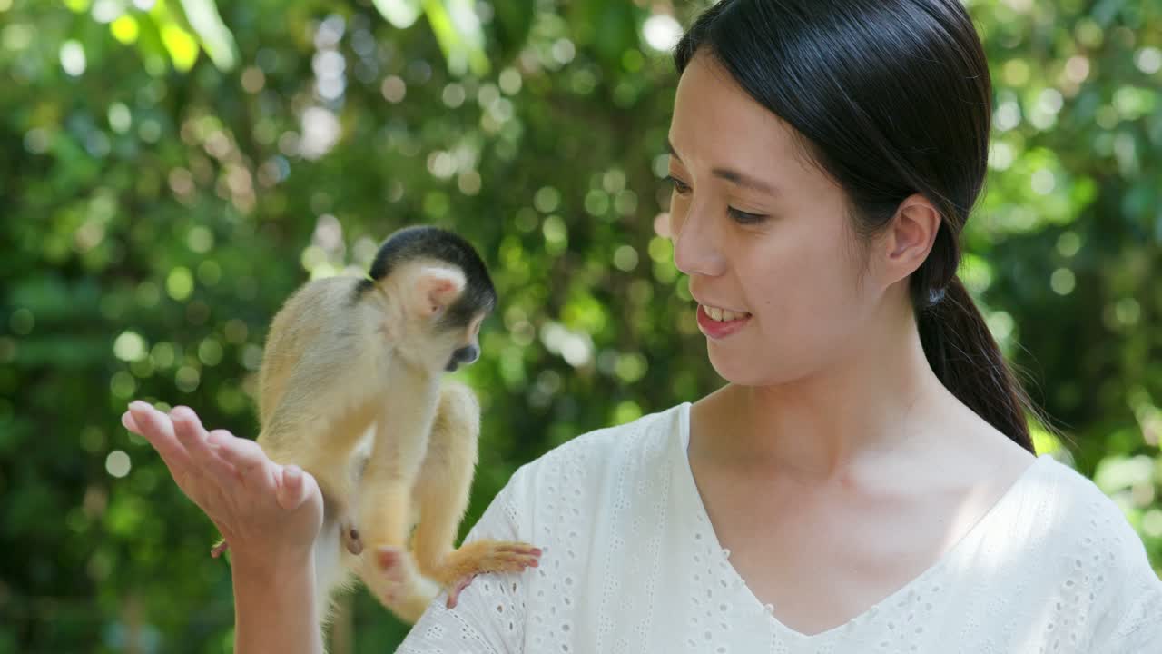 Woman and Squirrel Monkey