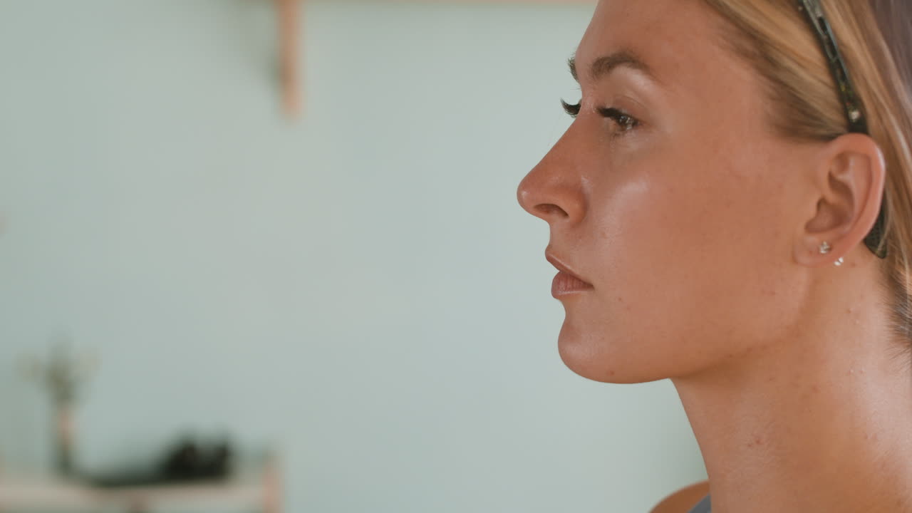 Woman with hand on face