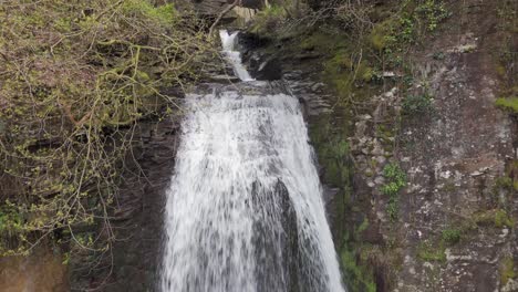 an aerial view of melinclourt waterfall on an overcast day, neath port talbot, south wales